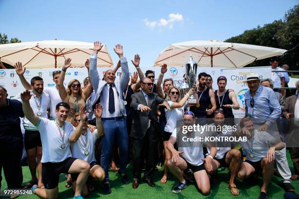 Cambridge rowing teams celebrates the second place at the end of the Reggia Challenge Cup 2018 in the Dolphins Fountain at the Park of the Reggia of...