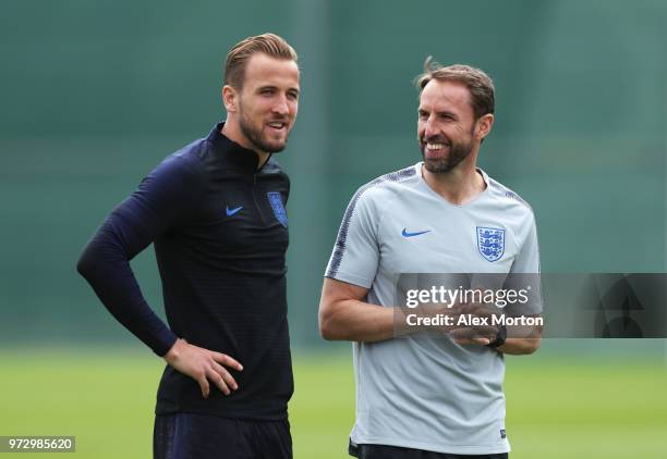 Gareth Southgate, Manager of England and Harry Kane of England look on during a training session as part of the England media access at Spartak...