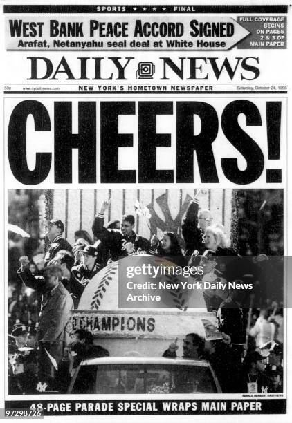 Daily News front page wrap dated Oct. 24 CHEERS!, New York Yankees in ticker tape parade to celebrate their victory in the World Series.