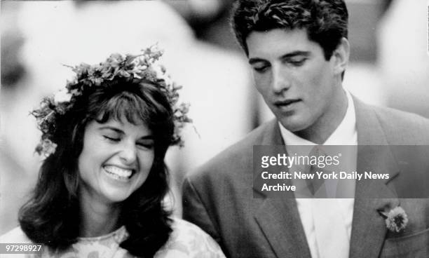 Matron of Honor Maria Shriver Schwarzenegger has a giggle with best man John F. Kennedy Jr. At wedding of his sister, Caroline Kennedy, to Edwin...