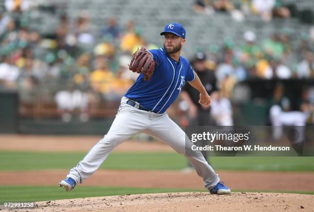 Danny Duffy of the Kansas City Royals pitches against the Oakland Athletics in the bottom of the first inning at the Oakland Alameda Coliseum on June...