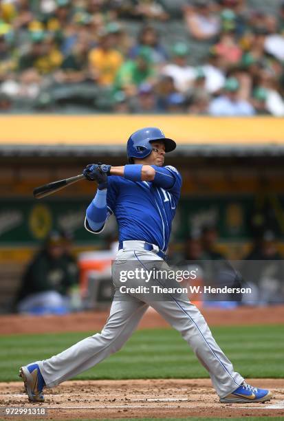 Ryan Goins of the Kansas City Royals hits a double against the Oakland Athletics in the top of the second inning at the Oakland Alameda Coliseum on...