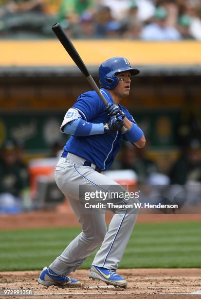 Ryan Goins of the Kansas City Royals hits a double against the Oakland Athletics in the top of the second inning at the Oakland Alameda Coliseum on...