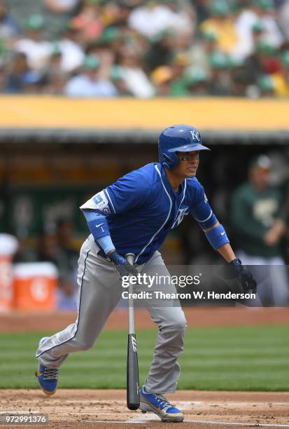 Ryan Goins of the Kansas City Royals hits a double against the Oakland Athletics in the top of the second inning at the Oakland Alameda Coliseum on...