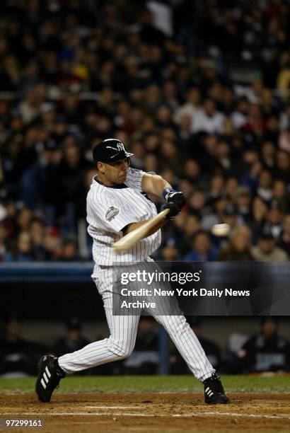 New York Yankees' Juan Rivera hits a double to bring in a run in the second inning of Game 2 of the World Series against the Florida Marlins at...