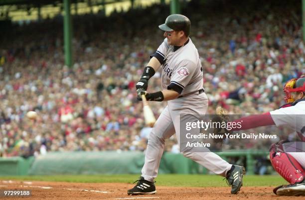 New York Yankees' Karim Garcia hits a single to bring in two runs in the second inning of Game 5 of the American League Championship Series against...