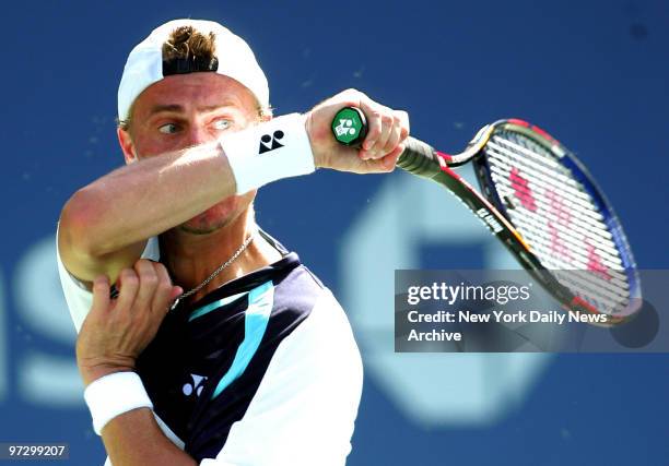 Third-seeded Australian Lleyton Hewitt watches his shot during his match against 25th-seeded American Taylor Dent at Arthur Ashe Stadium during the...