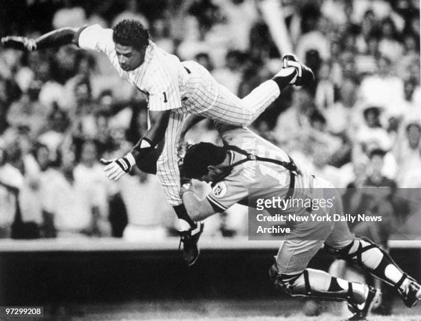 New York Daily News prize photograph of the New York Yankees' Deion Sanders taking home as the Kansas City Royals' Mike Macfarlane attempts to stop...
