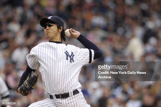 New York Yankees' Kei Igawa pitches in the seventh inning against the Boston Red Sox at Yankee Stadium in the Bronx. Igawa led the Yankees to beat...