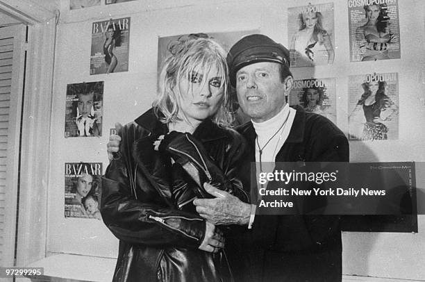 Singer Debbie Harry with fashion photographer Francesco Scavullo during break in photo session at his East 63rd St. Studio.