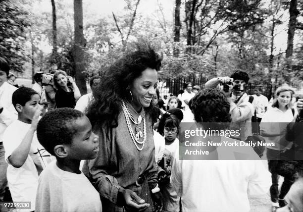 Singer Diana Ross signs autographs for fans during groundbreaking' ceremonies for long-delayed Central park playground she is underwriting. Three...