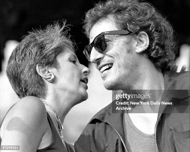 Joan Baez and Bruce Springsteen as they open the Amnesty benefit concert at JFK Stadium in Philadelphia.