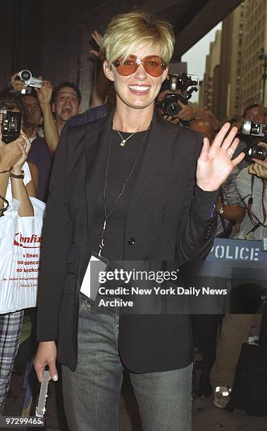 Singer Faith Hill, three months pregnant with her third child, waves as she arrives at Madison Square Garden to see the first of Madonna's five...