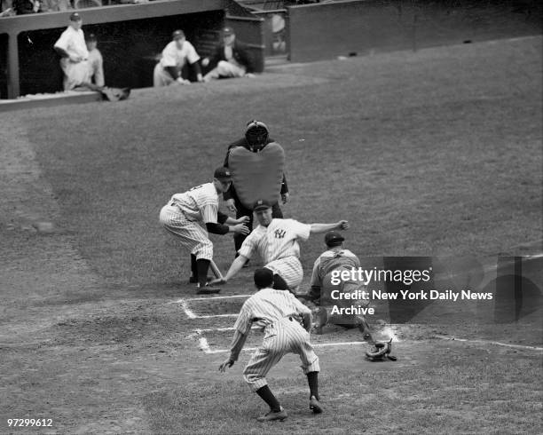 New York Yankees Lou Gehrig steals home in 5-1 victory over the St. Louis Browns at the Stadium.