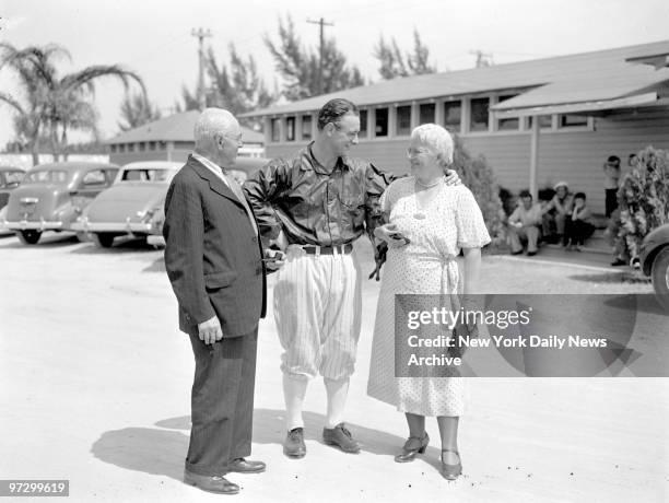 New York Yankees' Lou Gehrig with his mother and father at Huggins Field in St. Petersburg, FL.