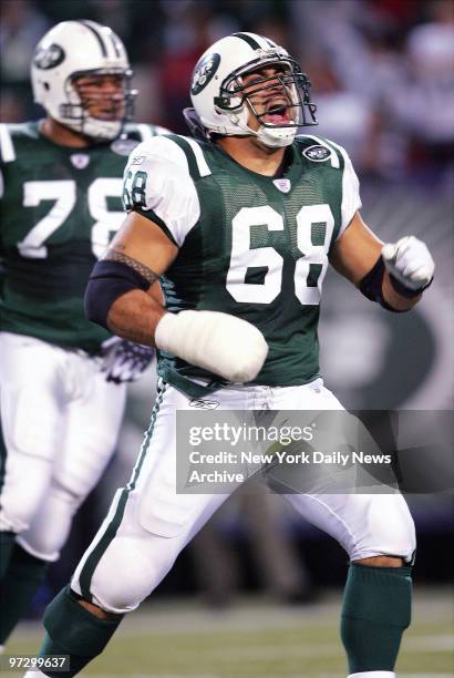 Center Kevin Mawae yells in celebration after the New York Jets score the game-winning field goal late in the fourth quarter against the Buffalo...
