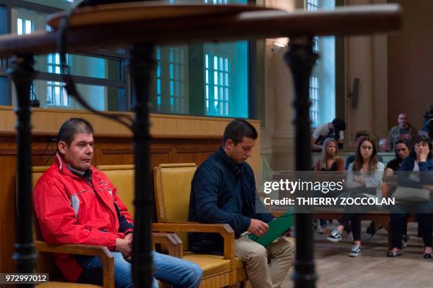 Portuguese defendants driver Armenio Pinto Martins and his uncle Ricardo Jose Martins Pinherio sit in the courthouse before the start of their trial...