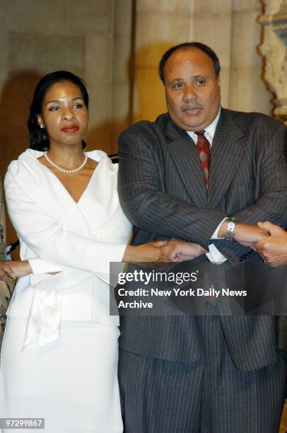 Martin Luther King 3rd and his fiancee, Andrea Waters, join hands as they sing "We Shall Overcome" during the Congress of Racial Equality's 22nd...