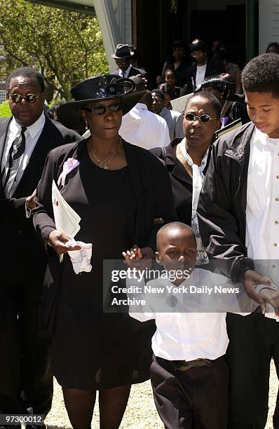 Joan Truman-Smith, mother of Wendy's massacre victim Anita Smith, Anita's 6-year-old brother Shakeem , and Anita's half-brother, Michael Smith, leave...