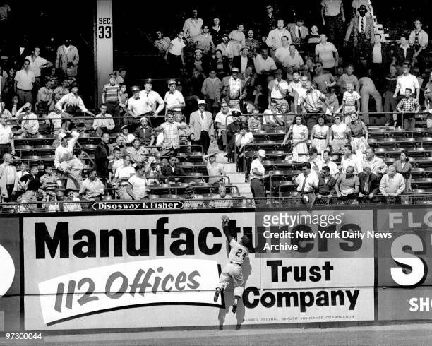 New York Giants' centerfielder Willie Mays make a spectacular catch at Ebbets Field.