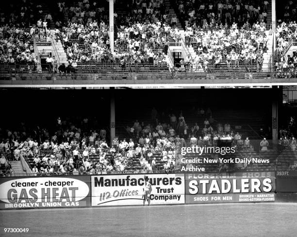 New York Giants' centerfielder Willie Mays make a spectacular catch at Ebbets Field.