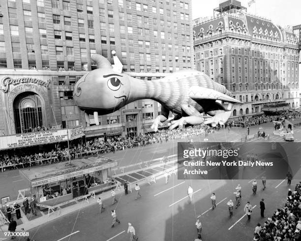 Friendly dragon floats over packed Times Square during the 37th annual Macy's Thanksgiving Day parade. An estimated throng of 1 000 spectators lined...