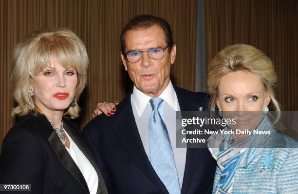 Joanna Lumley gets together with Roger Moore and his wife, Katrina, at the 29th International Emmy Awards Gala at the Sheraton Center.