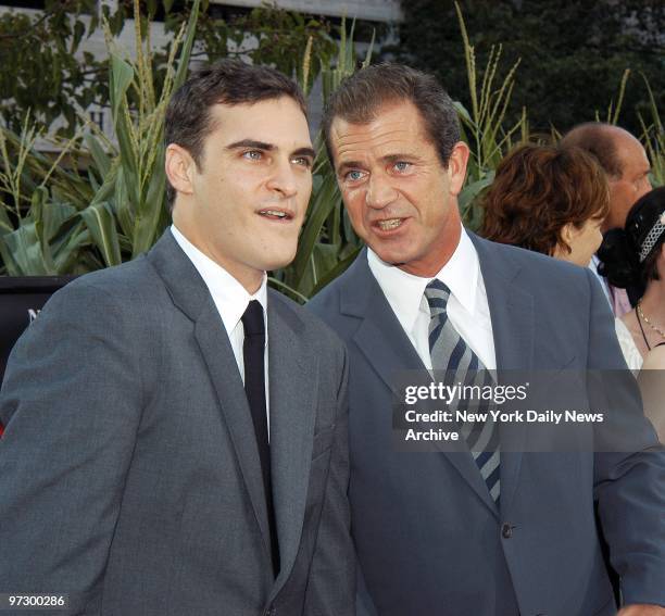 Joaquin Phoenix and Mel Gibson arrives at Lincoln Center's Avery Fisher Hall for the world premiere of the movie "Signs." They star in the film.