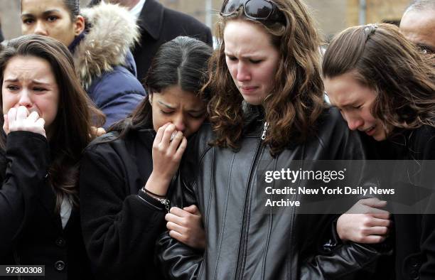 Friends and teammates grieve during a funeral procession for 10-year-old Douglas Jiang, Shuk Tse and Kevin Kwan outside Central Funeral Home in...