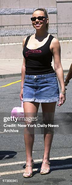 Singer Mariah Carey arrives at Roosevelt Field Mall in Garden City, L.I., to promote her latest CD, "Glitter." She sports a cut-up t-shirt bearing...