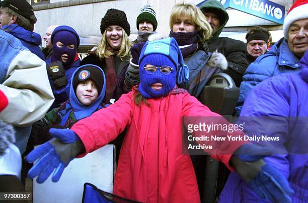This youngster embraces the cold weather as well as the festivities during the 74th annual Macy's Thanksgiving Day Parade.