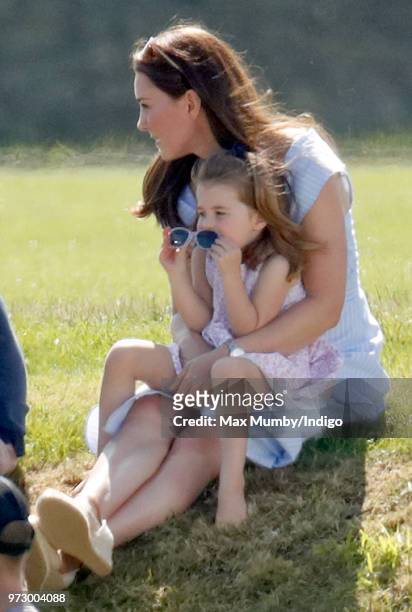 Catherine, Duchess of Cambridge and Princess Charlotte of Cambridge attend the Maserati Royal Charity Polo Trophy at the Beaufort Polo Club on June...