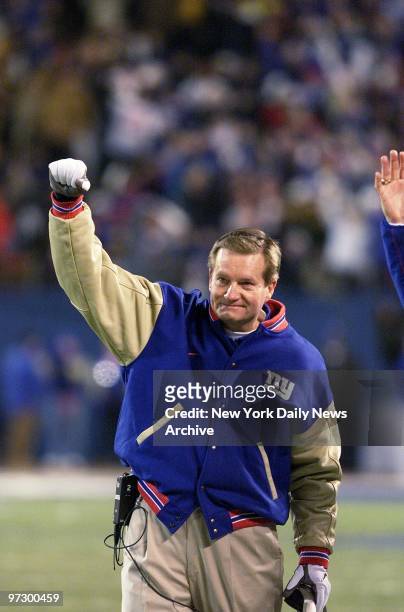 New York Giants' coach Jim Fassel shows his approval after his team's second touchdown against the Philadelphia Eagles in the National Football...