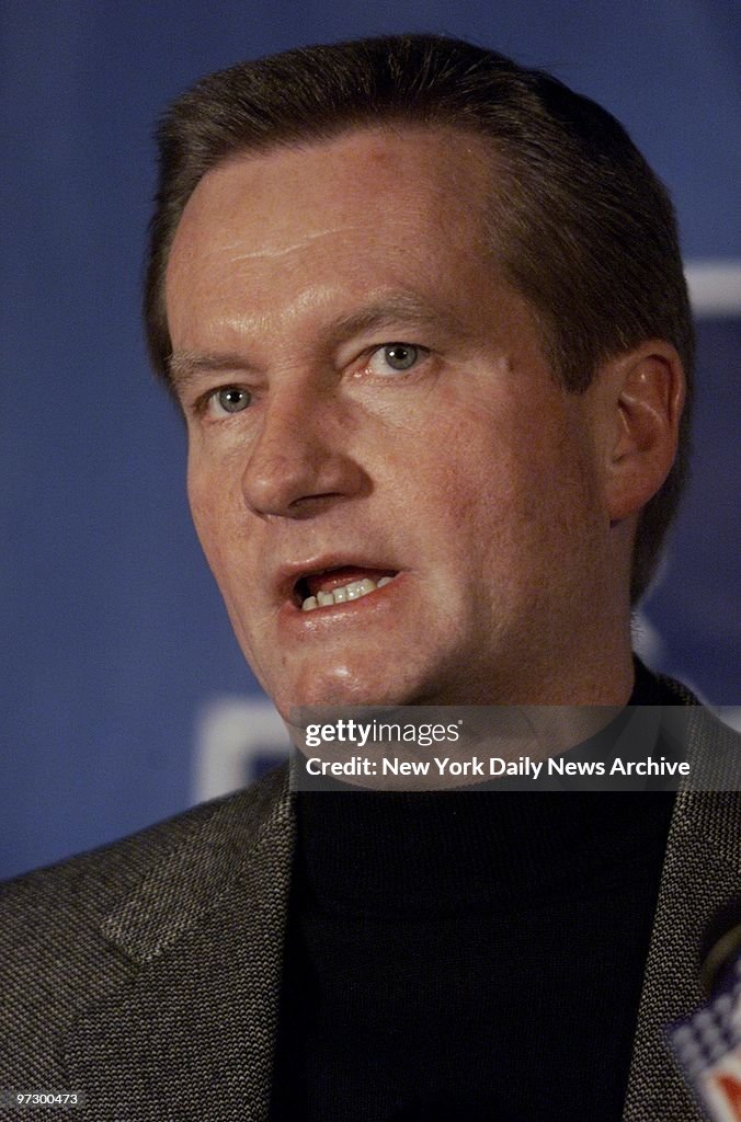 New York Giants' coach Jim Fassel speaks at a news conferenc