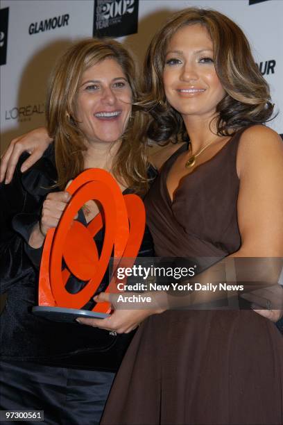 Chairwoman of Columbia Pictures Amy Pascal is joined by Jennifer Lopez, who presented her with the award they hold, at Glamour Magazine's annual...