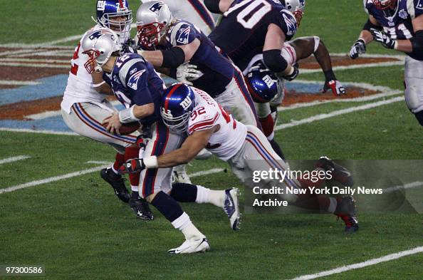 New York Giants' defensive end Michael Strahan sacks New Eng New York Giants' defensive end Michael Strahan sacks New Eng