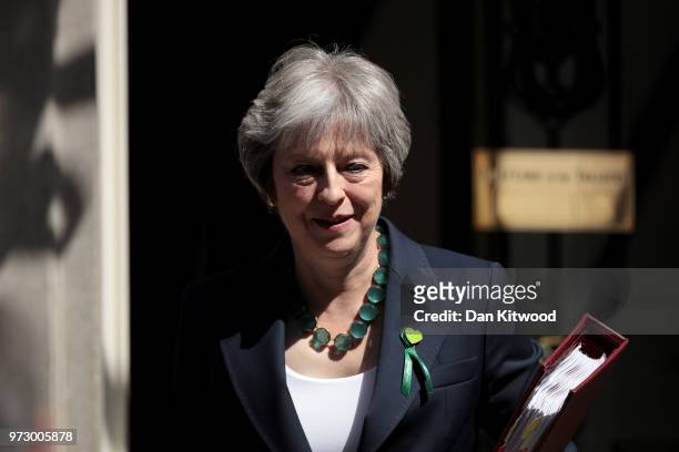 British Prime Minister Theresa May leaves Downing Street on June 13, 2018 in London, England. The Prime Minister will attend today the weekly Prime...
