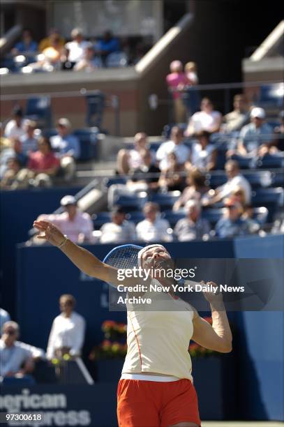 Martina Navratilova serves as she and Nadia Petrova take on Lisa Raymond and Samantha Stosur in the U.S. Open Women's Doubles quarterfinals in Arthur...