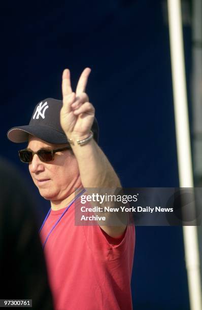 Singer Paul Simon, flashing a victory sign, arrives at the Sony Studios on 53rd St. To perform during "America: A Tribute to Heroes," a two-hour...