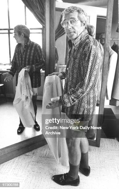 Singer Perry Como at his tailor's shop being fitted for trousers.