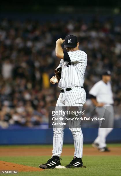 New York Yankees' pitcher Javier Vazquez reacts after Minnesota Twins' Justin Morneau hit a solo home run to give the Twins a 3-2 lead in the sixth...
