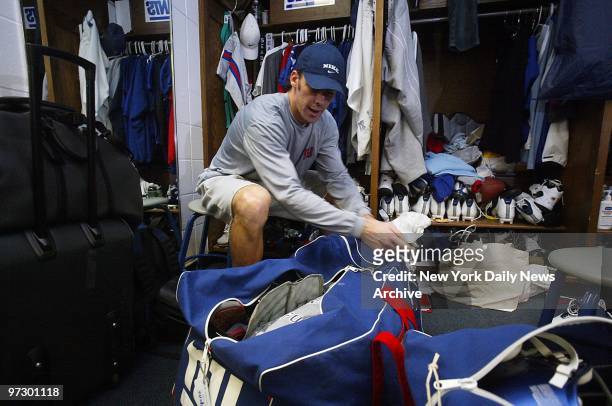 New York Giants' cornerback Jason Sehorn packs his bags in the locker room at Giants Stadium for a trip to California, where the team will face off...