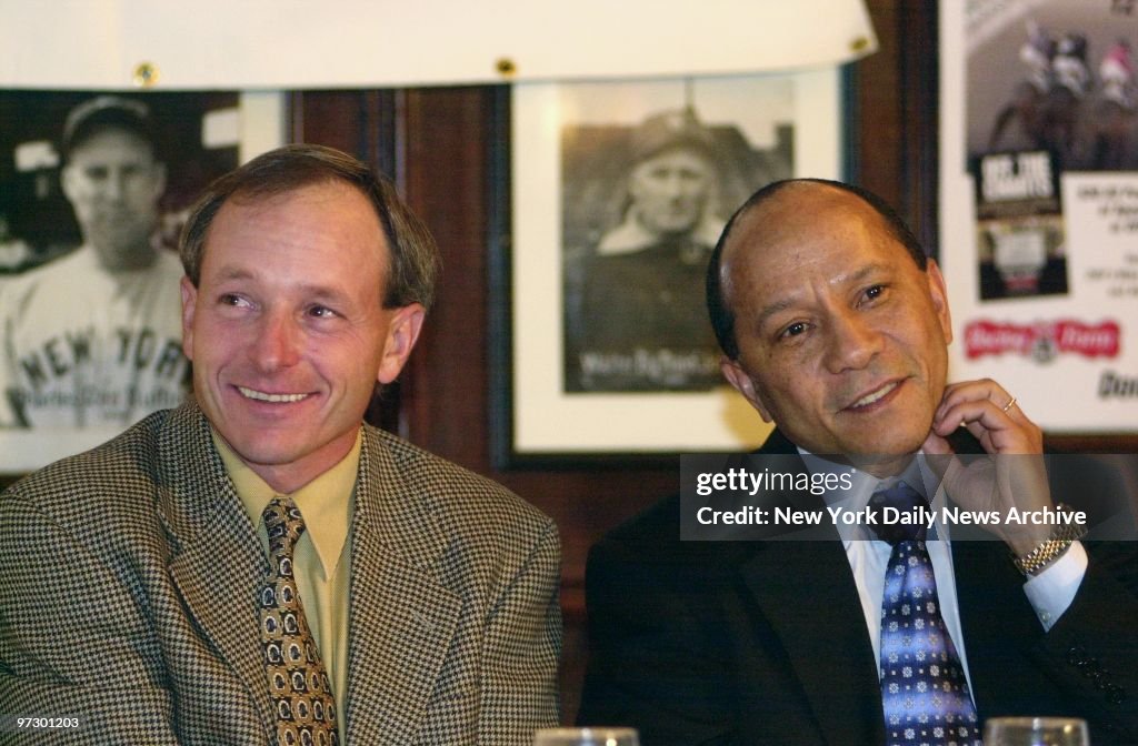 Jockeys Steve Cauthen (left) and Jorge Velasquez share a tab
