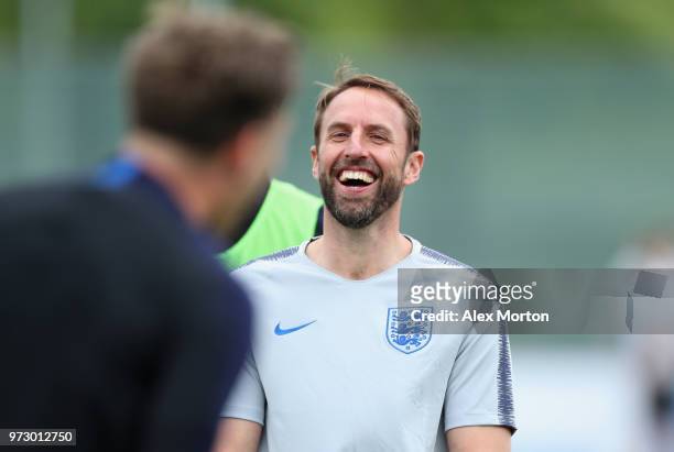 Gareth Southgate, Manager of England laughs during a training session as part of the England media access at Spartak Zelenogorsk Stadium ahead of the...