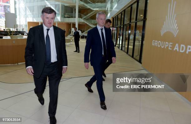 Augustin de Romanet , head of the ADP group and French Economy Minister Bruno Le Maire walk in the ADP headquarters near the Roissy Charles de Gaulle...