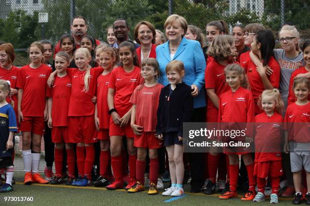 German Chancellor Angela Merkel , Federal Commissioner for Migration, Refugees and Integration Annette Widmann-Mauz and former football star Cacau...