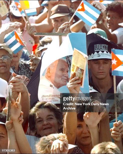Thousands of people crowd around Santa Clara for Pope John Paul's first Mass in Cuba.
