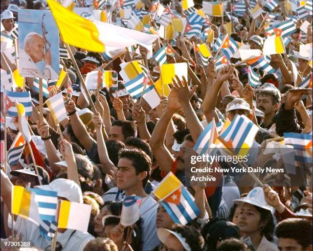 Thousands of people crowd around Santa Clara for Pope John Paul's first Mass in Cuba.