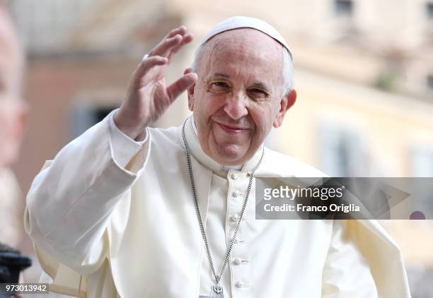 Pope Francis waves to the pilgrims gathered in St. Peter's Square for the general audience on June 13, 2018 in Vatican City, Vatican. Pope Francis...