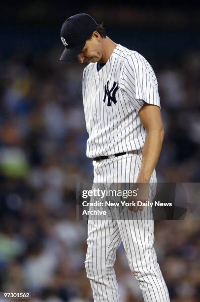 New York Yankees' starter Randy Johnson reacts with frustration during the third inning of game against the Oakland Athletics at Yankee Stadium. The...